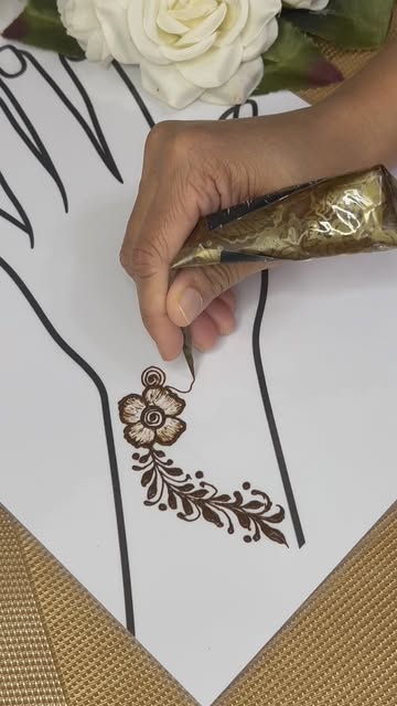 A gold-wrapped organic cone drawing a leaf trail